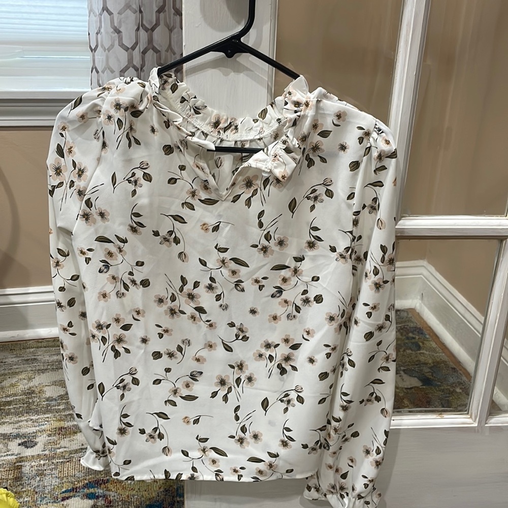 White blouse with flowered prints.